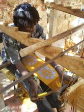 A person using a loom